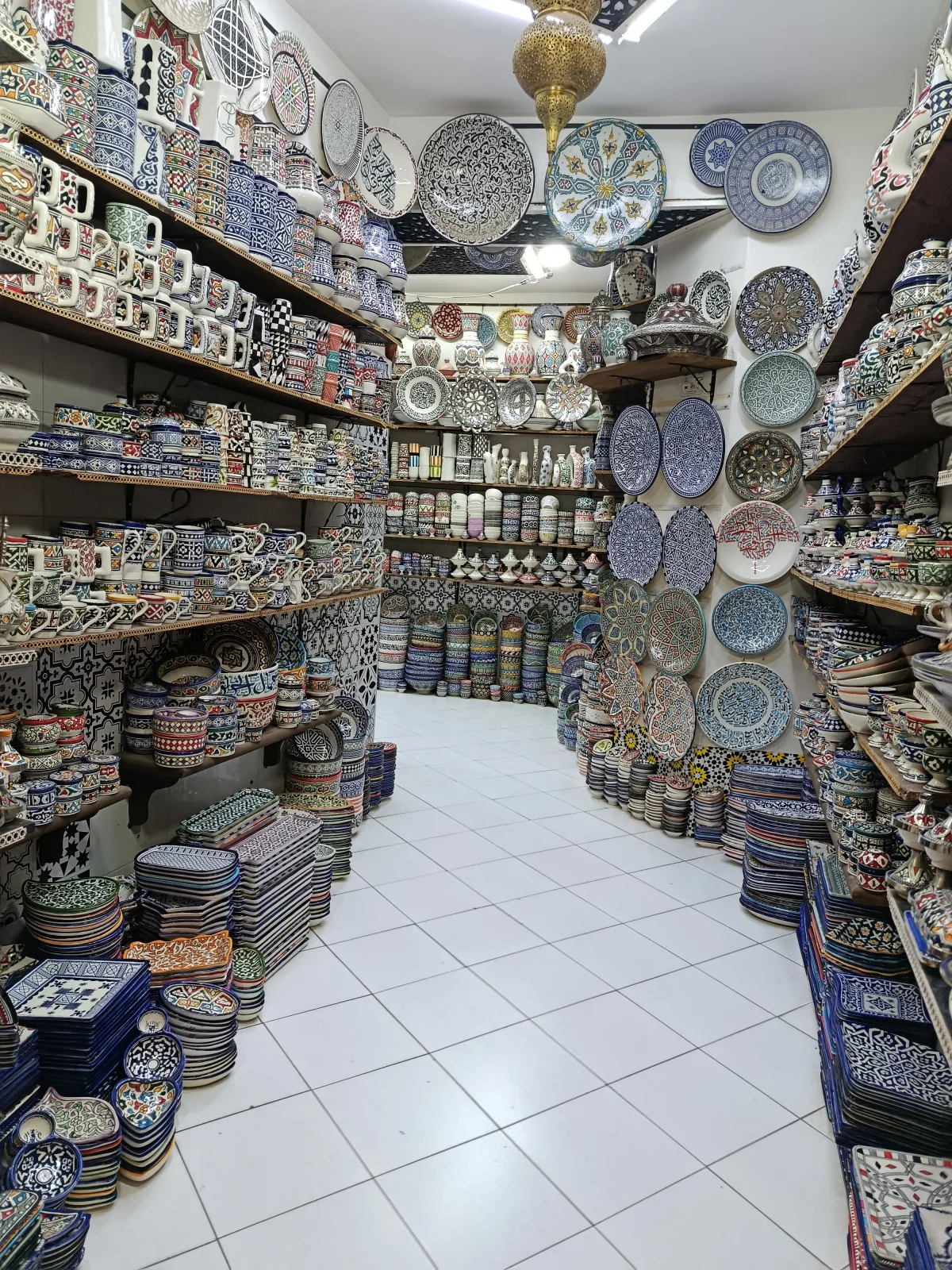 Pottery and earthenware displayed in a Fes medina shop