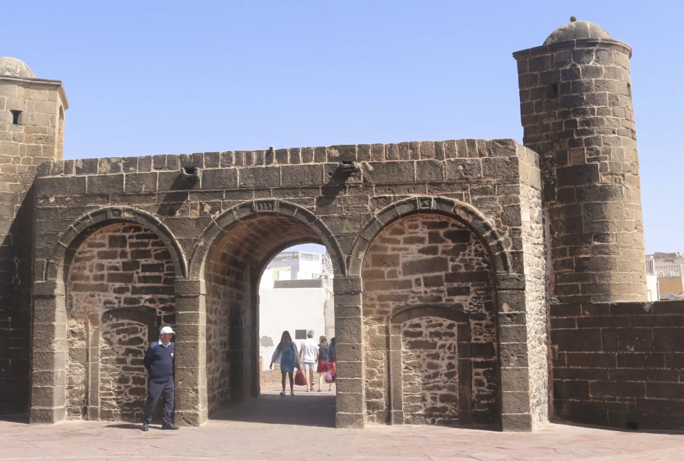 Historic stone gateway beside Essaouira harbour
